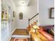 Foyer with hardwood floors, staircase, and decorative mirror, offering a warm welcome at 5617 Sugarcane Ct, Mint Hill, NC 28227