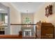 View from above shows a lovely foyer with a chandelier, hardwood floors and half-moon window bringing in natural light at 5617 Sugarcane Ct, Mint Hill, NC 28227