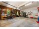 This garage features an organized layout, storage shelves, work benches, and ample room for vehicles at 5617 Sugarcane Ct, Mint Hill, NC 28227