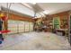 The spacious garage features storage, work benches, and a pull down door for convenience at 5617 Sugarcane Ct, Mint Hill, NC 28227