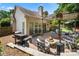 Outdoor entertaining space showcasing a fire pit, grill, patio seating, and backyard views at 5818 Downfield Wood Dr, Charlotte, NC 28269