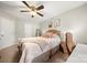Cozy bedroom with neutral carpet and decor, ceiling fan and ample natural light at 5818 Downfield Wood Dr, Charlotte, NC 28269