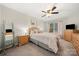 Well-lit bedroom has plush carpeting, large windows, and a private ensuite at 5818 Downfield Wood Dr, Charlotte, NC 28269