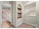 Cozy bonus room with decorative niche and shelving at 5818 Downfield Wood Dr, Charlotte, NC 28269