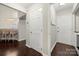 Hallway with view into eat-in kitchen and lots of doors at 5818 Downfield Wood Dr, Charlotte, NC 28269