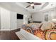 Spacious bedroom boasting a trey ceiling, hardwood floors, and ensuite bathroom at 5818 Downfield Wood Dr, Charlotte, NC 28269