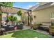 Charming patio with brick base, tv, outdoor furniture and artificial turf at 5818 Downfield Wood Dr, Charlotte, NC 28269