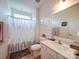 Neutral bathroom with a walk in shower, modern sink and fixtures, and plenty of natural light at 6266 Swanport Rd, Lancaster, SC 29720