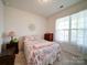 Cozy bedroom filled with natural light from a large window, complete with a comfortable bed and stylish decor at 6266 Swanport Rd, Lancaster, SC 29720