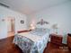 Cozy bedroom with hardwood floors and a decorative headboard at 6266 Swanport Rd, Lancaster, SC 29720