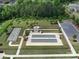 Overhead view of community bocce ball courts and an open lawn area with nearby parking at 6266 Swanport Rd, Lancaster, SC 29720