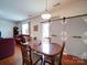 Inviting dining area with hardwood floors, sliding barn door, and seamlessly connected to the living room at 6266 Swanport Rd, Lancaster, SC 29720