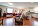 Open-concept living area featuring hardwood floors, seamlessly connecting the kitchen, dining, and living spaces at 6266 Swanport Rd, Lancaster, SC 29720
