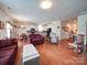Open concept living area with hardwood floors seamlessly connects to the kitchen at 6266 Swanport Rd, Lancaster, SC 29720
