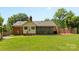 View of the backyard with a screened-in porch and an adjacent patio at 6301 Cherrycrest Ln, Charlotte, NC 28217