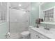 Well-lit bathroom featuring a glass enclosed shower, commode and vanity at 6301 Cherrycrest Ln, Charlotte, NC 28217