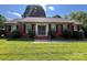 Charming brick home with black shutters, well-manicured lawn, and inviting front entrance at 6301 Cherrycrest Ln, Charlotte, NC 28217