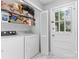 Functional laundry area with a door to the outside at 6301 Cherrycrest Ln, Charlotte, NC 28217