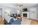 Bright living room with fireplace and neutral rug at 6301 Cherrycrest Ln, Charlotte, NC 28217