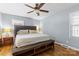 Relaxing bedroom with hardwood floors, a padded headboard and coordinating bench at 6301 Cherrycrest Ln, Charlotte, NC 28217