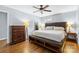 Spacious main bedroom with hardwood floors, lamps and ample storage furniture at 6301 Cherrycrest Ln, Charlotte, NC 28217