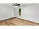 Well-lit bedroom with wood floors, neutral walls and a ceiling fan for comfort at 6839 Wagon Oak Rd, Charlotte, NC 28212
