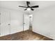 A freshly painted bedroom with new floors, ample storage, and a ceiling fan at 6839 Wagon Oak Rd, Charlotte, NC 28212