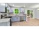 Updated kitchen features stainless steel appliances, granite countertops and slider to the deck at 6839 Wagon Oak Rd, Charlotte, NC 28212