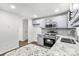 Updated kitchen features stainless steel appliances, granite countertops, and modern fixtures at 6839 Wagon Oak Rd, Charlotte, NC 28212