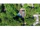 Aerial view of the property showcasing the house, pool, deck, and surrounding greenery at 701 5Th Ne Ave, Conover, NC 28613