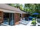 Outdoor deck with lounge chairs, grill, and seating area, ideal for entertaining and enjoying the surrounding nature at 701 5Th Ne Ave, Conover, NC 28613