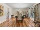 Open dining room featuring hardwood floors, chandelier lighting, and a large window for plenty of natural light at 701 5Th Ne Ave, Conover, NC 28613
