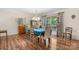 Dining room featuring hardwood floors, elegant chandelier lighting, a large window and stylish décor at 701 5Th Ne Ave, Conover, NC 28613