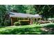 Well-maintained home with manicured lawn, charming front porch, and mature trees providing shade at 701 5Th Ne Ave, Conover, NC 28613