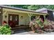Inviting front porch features a seating area and colorful flowers, perfect for enjoying a peaceful moment at 701 5Th Ne Ave, Conover, NC 28613