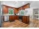 Kitchen with wood cabinetry and stainless steel appliances at 701 5Th Ne Ave, Conover, NC 28613