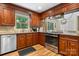 Kitchen with stainless steel appliances, wood cabinets, and eat-in dining space at 701 5Th Ne Ave, Conover, NC 28613
