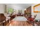 Cozy living room featuring a brick fireplace, hardwood floors, and comfortable seating at 701 5Th Ne Ave, Conover, NC 28613