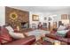 Charming living room with a brick fireplace, hardwood floors and leather sofas at 701 5Th Ne Ave, Conover, NC 28613