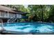 Enjoy the swimming pool surrounded by a well-maintained yard, perfect for summer relaxation and outdoor activities at 701 5Th Ne Ave, Conover, NC 28613