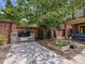 Backyard featuring an outdoor built in grill, a garden, and stone details, perfect for entertaining at 7011 Conservatory Ln, Charlotte, NC 28210