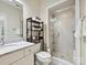 Clean bathroom with glass enclosed shower, and floating vanity at 7011 Conservatory Ln, Charlotte, NC 28210