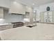 Close-up of a bright, modern kitchen with stainless steel appliances at 7011 Conservatory Ln, Charlotte, NC 28210
