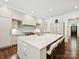 Large kitchen with white cabinets and a large island at 7011 Conservatory Ln, Charlotte, NC 28210