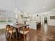 Kitchen with modern white cabinets and hardwood floors at 7011 Conservatory Ln, Charlotte, NC 28210