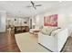 Open concept living room with dining area and hardwood floors at 7011 Conservatory Ln, Charlotte, NC 28210