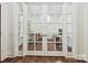 An office area with french doors and hardwood floors at 7011 Conservatory Ln, Charlotte, NC 28210