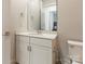 This half-bathroom features a decorative mirror and modern fixtures at 8008 Brookbank Dr, Charlotte, NC 28269