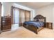 This bedroom features carpeted floors and stylish curtains for a warm and inviting atmosphere at 8008 Brookbank Dr, Charlotte, NC 28269