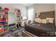 This cozy bedroom features a gray shag rug, closet shelving, and vanity at 8008 Brookbank Dr, Charlotte, NC 28269